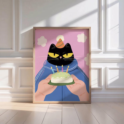 May include: A framed illustration features a black cat wearing a party hat and blue jacket, holding a small cake with lit candles. The background is pink with white cloud shapes. The artwork is in a wooden frame.