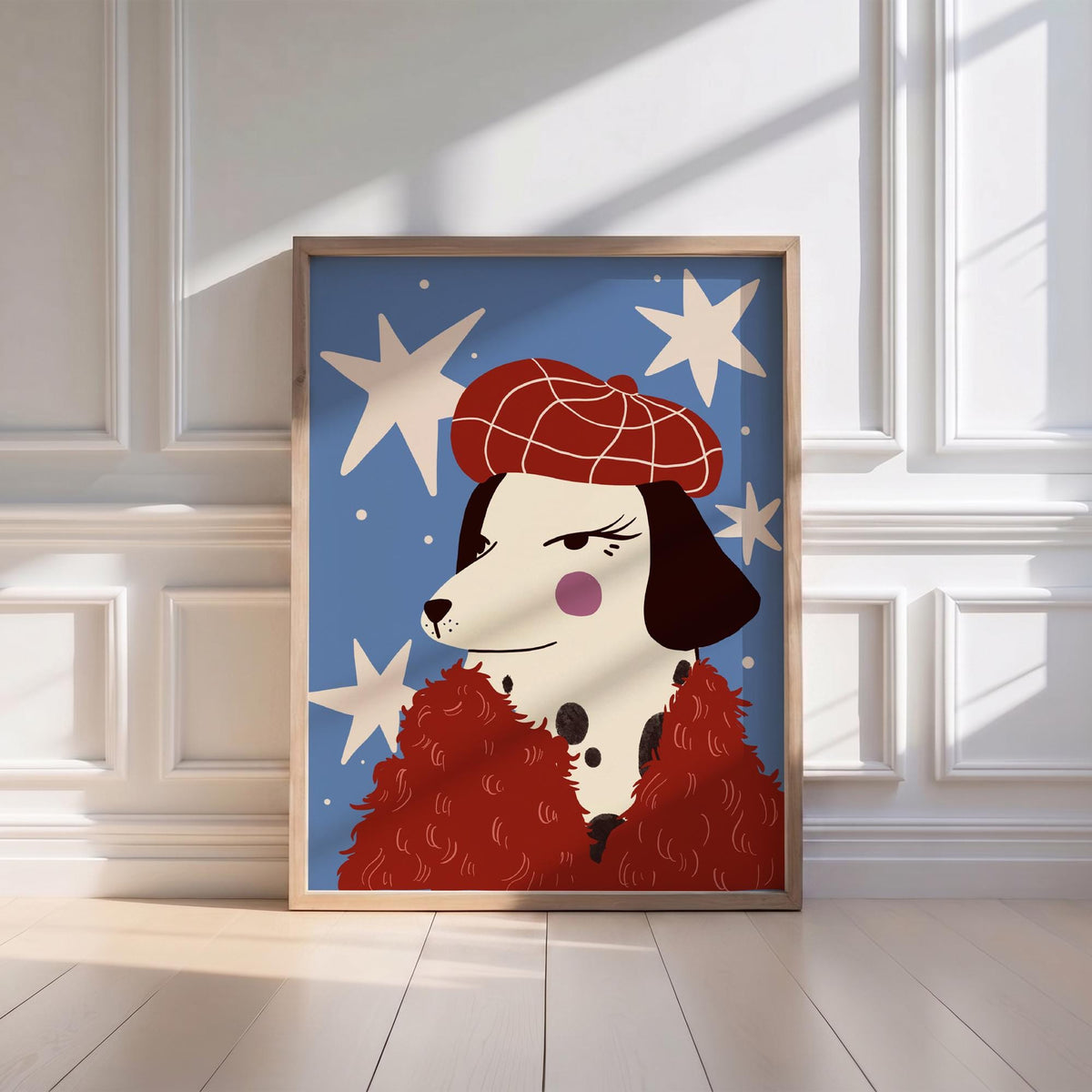 May include: A framed art print featuring a stylized Dalmatian dog wearing a red beret and a red fluffy scarf. The background is blue with white star shapes. The dog has black spots and a pink cheek.