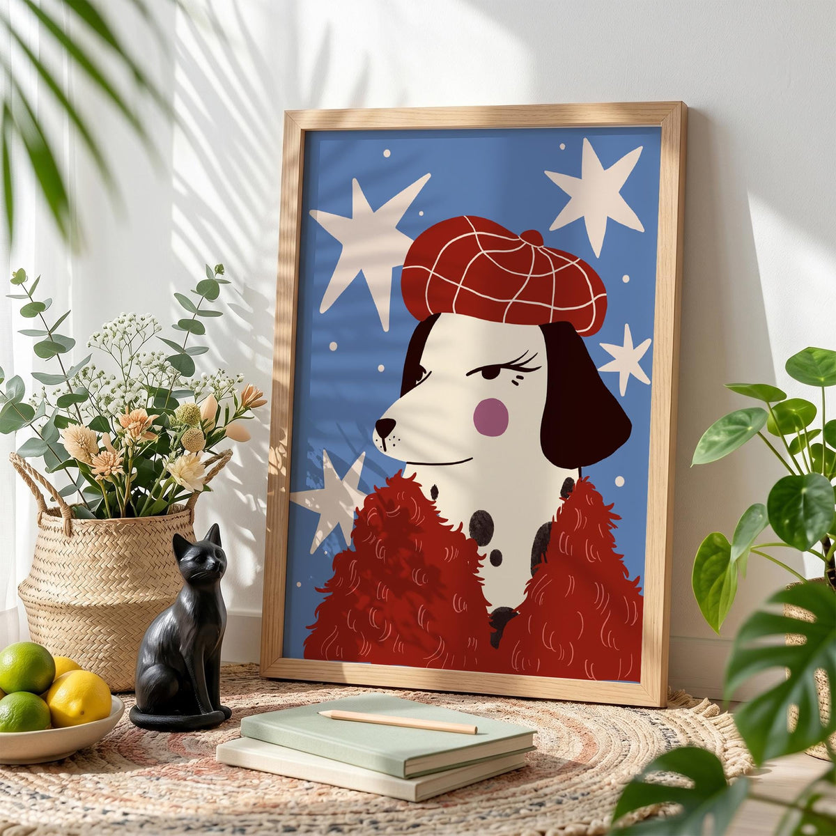 May include: A framed art print featuring a stylish Dalmatian dog illustration. The dog wears a red beret and a red fluffy scarf against a blue background with white star shapes. The artwork is in a wooden frame.