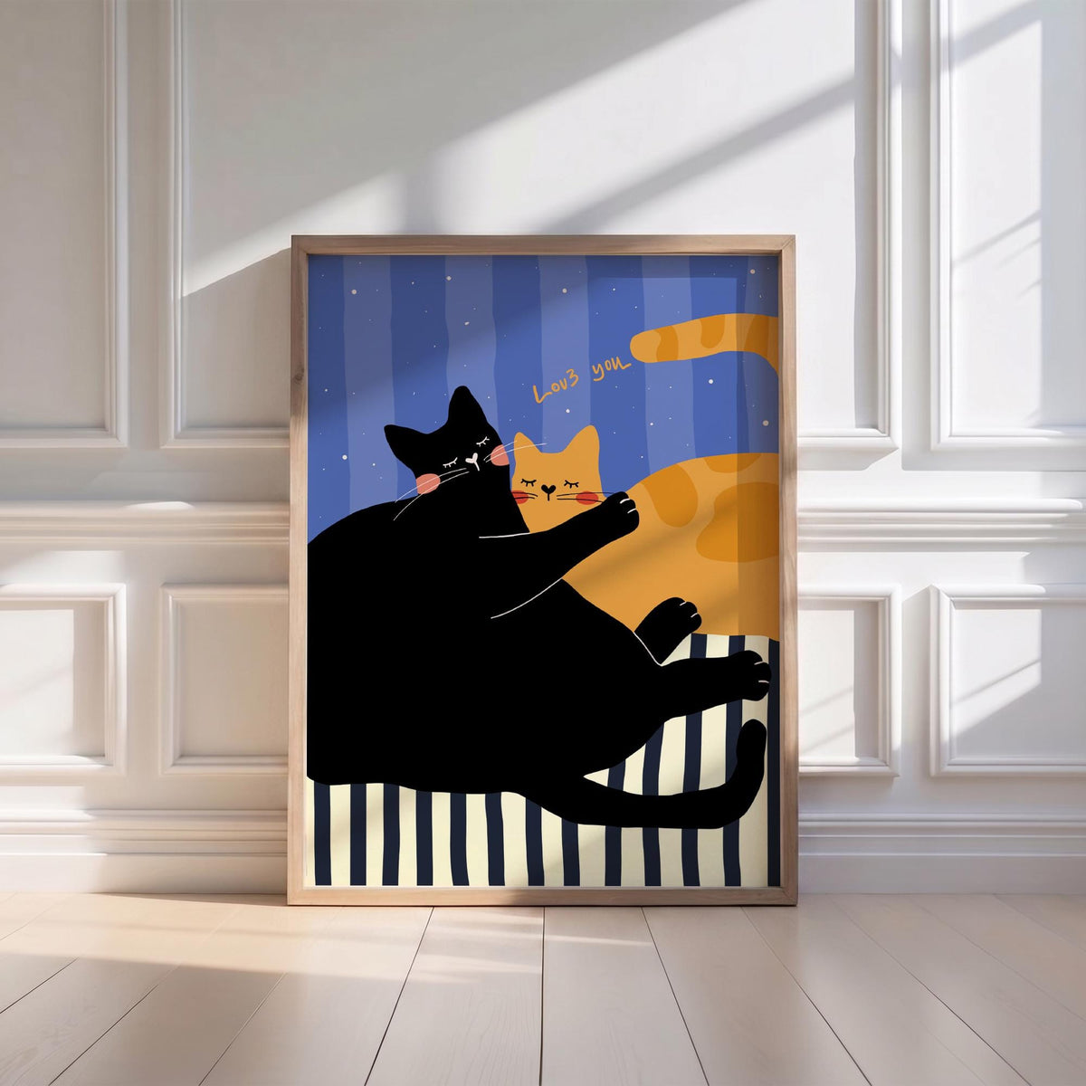 May include: A framed art print featuring two cartoon cats. One black cat hugs an orange cat, with the words "Love you" above them. The background is blue with vertical stripes and stars, and the cats are on a striped surface.