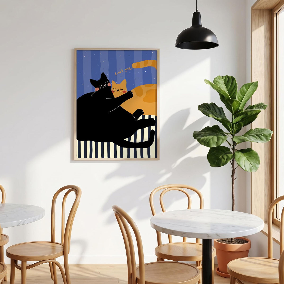May include: A framed art print featuring two cartoon cats. One black cat hugs an orange cat. The background has blue vertical stripes and the words "Loves you." The bottom has black and white stripes.