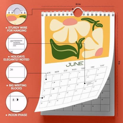 May include: A wall calendar featuring a floral design with the month of June displayed. The calendar has a sturdy wire for hanging and measures 8.5 x 11 inches. It includes holidays, big writing blocks, and moon phases.