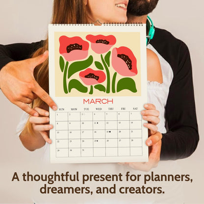 May include: A calendar featuring a floral design with red poppies and green leaves. The month of March is displayed, with a grid of dates. The text "A thoughtful present for planners, dreamers, and creators" is at the bottom.