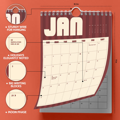 May include: A wall calendar measuring 8.5 inches by 11 inches with a sturdy wire for hanging. The page shows January with large writing blocks, noted holidays like Martin Luther King Jr. Day, and moon phase icons. The design features a maroon striped background.