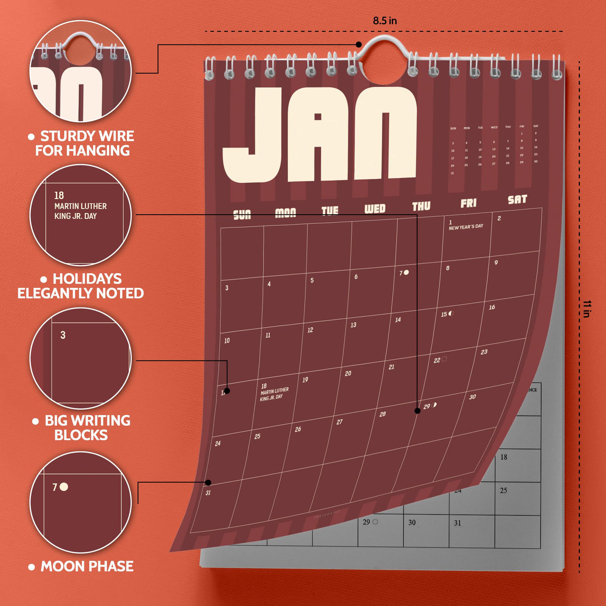 May include: A wall calendar measuring 8.5 inches by 11 inches with a dark red background and white text. It features a sturdy wire for hanging, clearly marked holidays like Martin Luther King Jr. Day, large writing blocks, and moon phases.