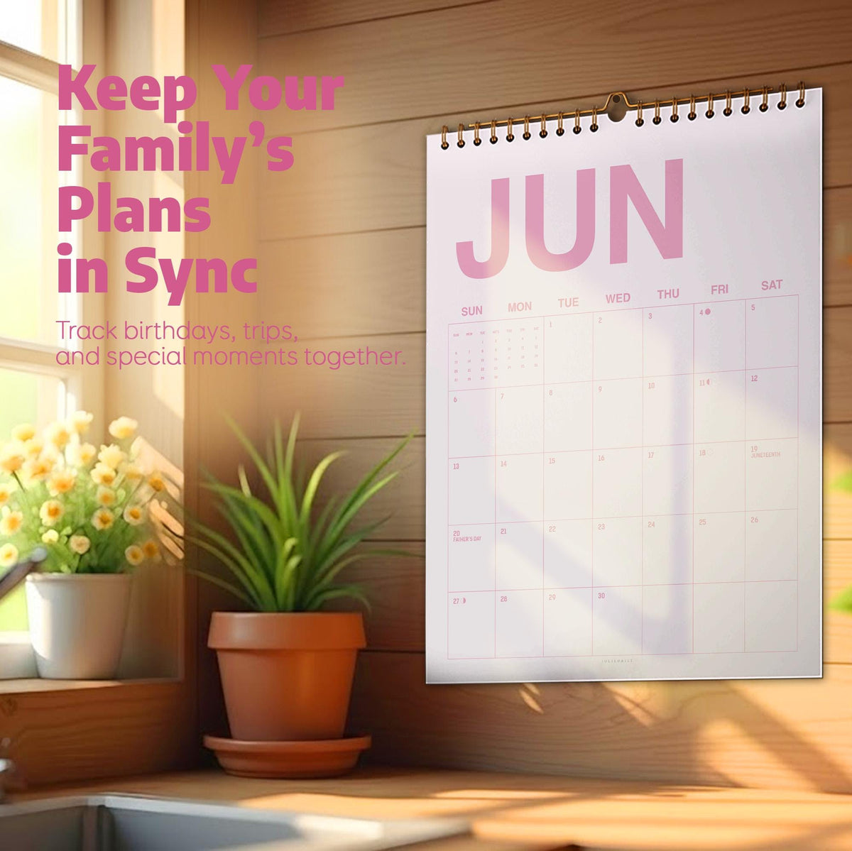 May include: A wall calendar for the month of June with a white background and pink text. The calendar features a spiral binding at the top. The text reads: Keep Your Family's Plans in Sync. Track birthdays, trips, and special moments together.