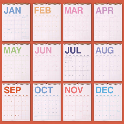 May include: A wall calendar featuring twelve individual pages, one for each month of the year. Each page displays the month name in a distinct pastel color at the top, followed by a grid of days with thin black lines on a white background.