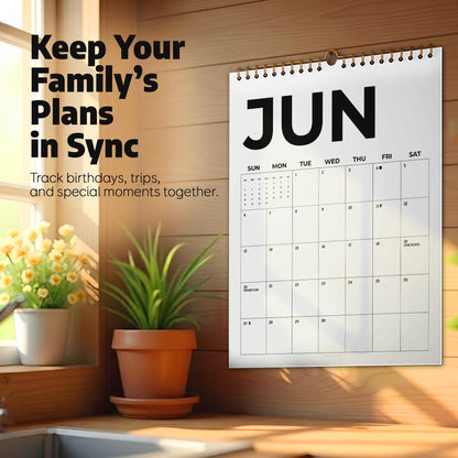 May include: A wall calendar for the month of June with a white background and black text. The calendar features a grid layout with days of the week and numbered dates. Text on the left reads: Keep Your Family's Plans in Sync. Track birthdays, trips, and special moments together.