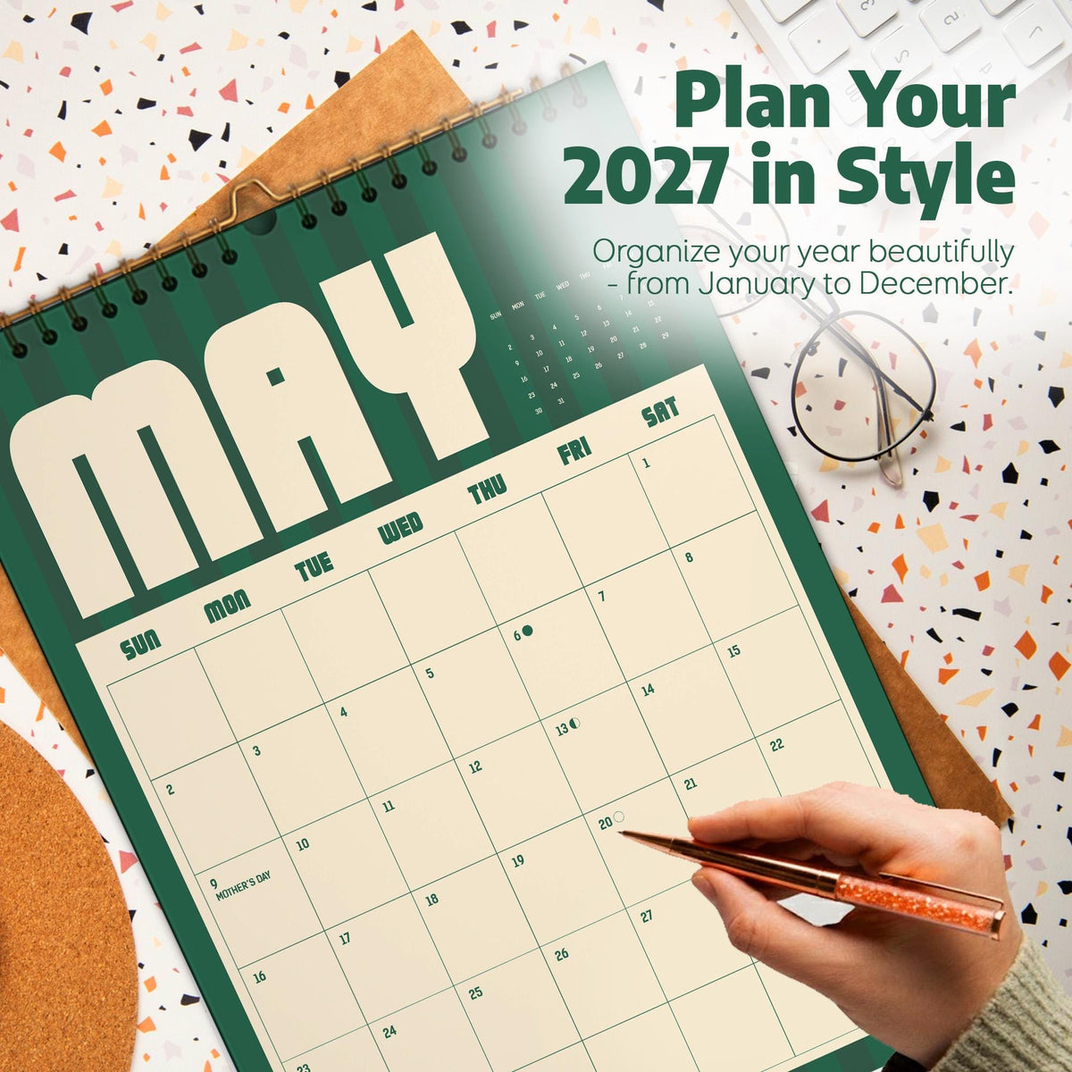 May include: A 2027 wall calendar featuring a dark green and cream color scheme. The page displays the month of May with a grid of numbered days, including the text Plan Your 2027 in Style and Organize your year beautifully - from January to December.