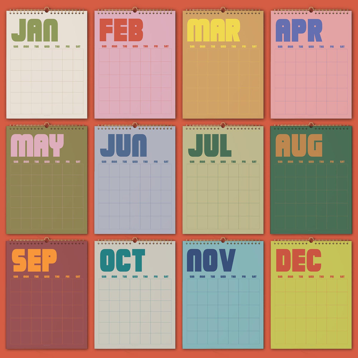 May include: A twelve-month wall calendar featuring individual pages for January through December. Each page displays a bold, sans-serif month name at the top, followed by a grid for days of the week labeled SUN, MON, TUE, WED, THU, FRI, SAT.
