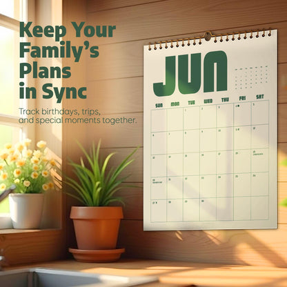 May include: A wall calendar with a cream background and dark green text displaying the month of June. The calendar features a grid layout with days of the week and dates. The text Keep Your Family's Plans in Sync is printed on the left side.